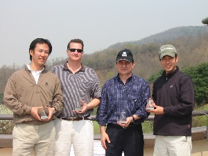 Second place team winners from the April golf tournament gather afterward, including (l-r) James Han, Capt. Cope Leuenberger, USAF, Capelo and Herman Park, General Dynamics IT.